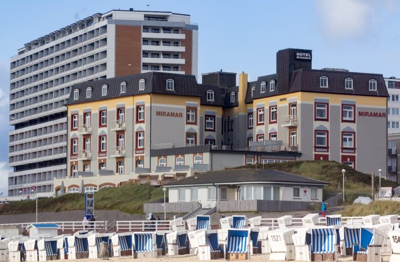 a group of buildings with chairs in front of them